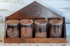 Glass Storage Jars With Chocolate On Wood Shelf