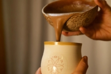 Pouring Cacao Elixir Into Mug